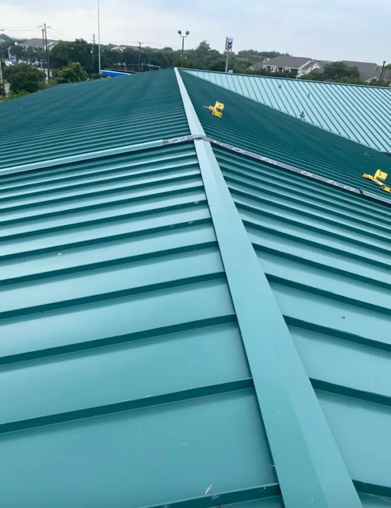 Green commercial metal roof ridge and valley for Metal Roof Repair in Inverness Highlands South